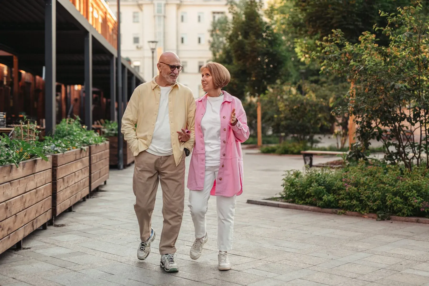 An older couple enjoying a walk together outdoors