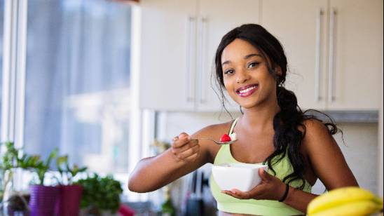 happy family, relieved, discussing health checkup results with a doctor, photorealistic, in a modern hospital consultation room with a computer and anatomical models, highly detailed, open window with view of nature, high resolution, balanced colors, soft afternoon light, shot with a 35mm lens.